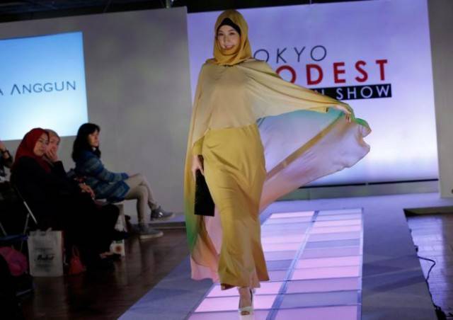 Hijab-clad models walk ramp at fashion show