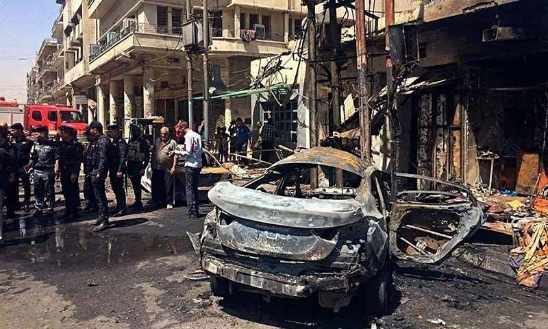 Two car bombs kill 14, injure 50 in central Baghdad