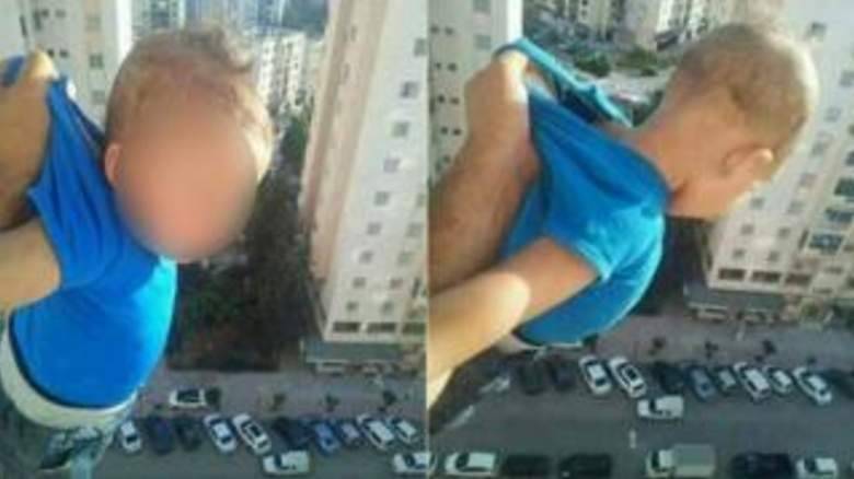 FB-frenzy dangles baby from window for 1,000 likes