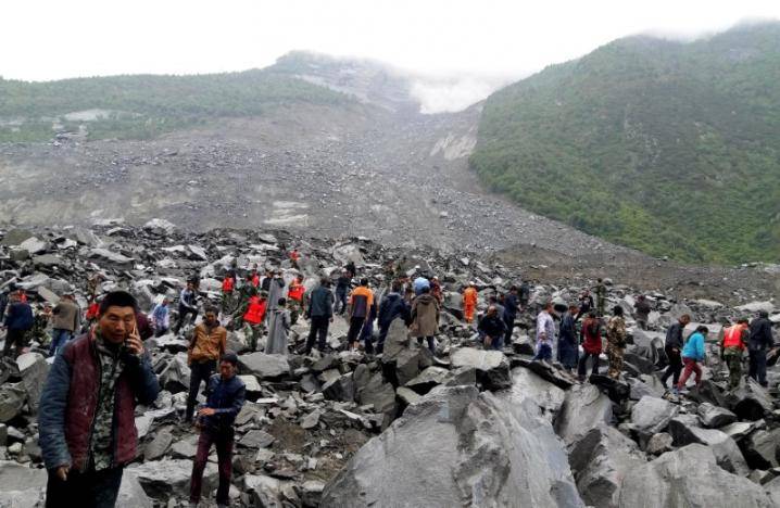 15 dead, scores missing hours after landslide buries Chinese village