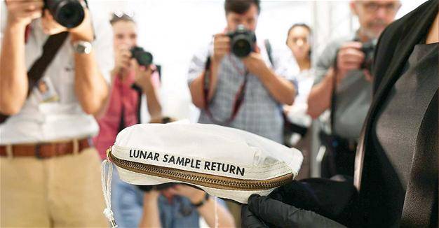 Neil Armstrong's moon dust bag sells for $1.8 million at auction