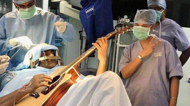 watch: Indian musician plays guitar during brain surgery