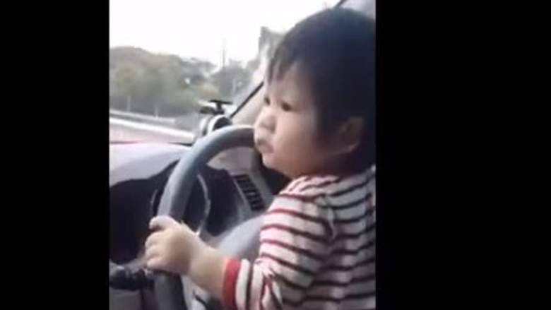 Watch: baby drive car on a busy highway, sparks outrage