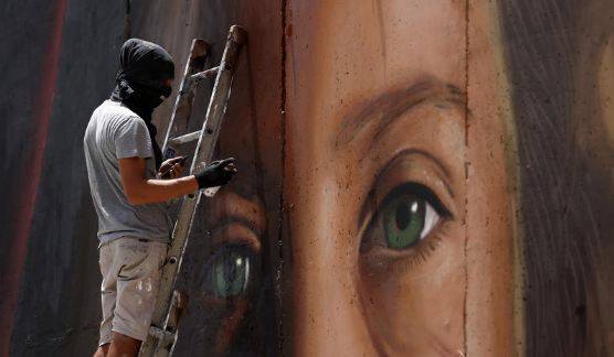Israel arrests Italians who painted West Bank mural of Palestinian teen
