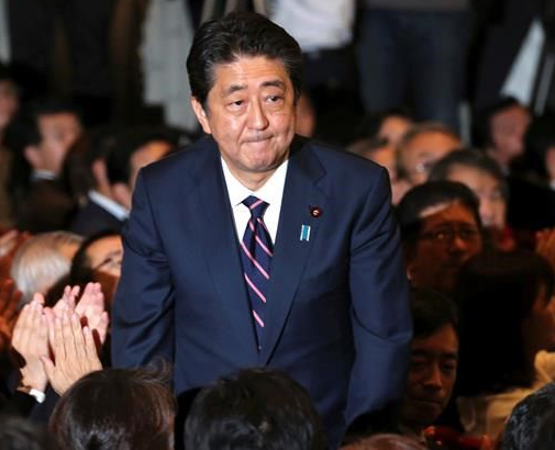 Japan's PM Abe re-elected as party head for three more years