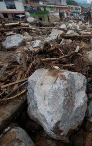 Death toll in Indonesia flood, landslide rises to 26