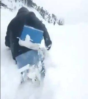 Watch: Health worker struggles through snow to protect child against polio